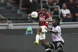 Milan holds on with 10 men to edge Udinese while Juventus beats 10-man Lazio