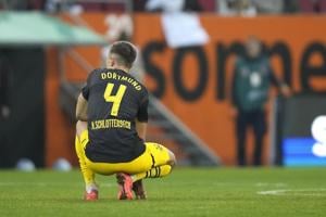 Dortmund slumps to another loss at Augsburg as Leipzig tops the Bundesliga