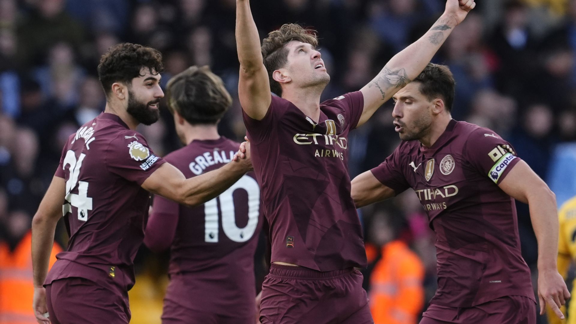 Stones' stoppage-time winner sends Man City top at Wolves