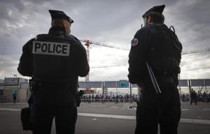 Mounted police and helicopters survey fans for France-Israel soccer match after attacks