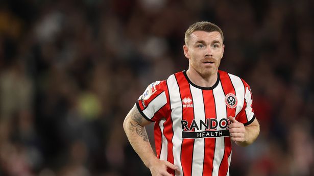 Ex-Premier League star rushed to hospital after falling ill on pitch minutes before kick-off