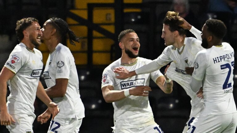 AFC Wimbledon earn play-off advantage with narrow win at Notts County