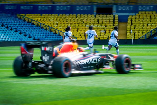 Red Bull star drives F1 car on Premier League pitch in race against footballers
