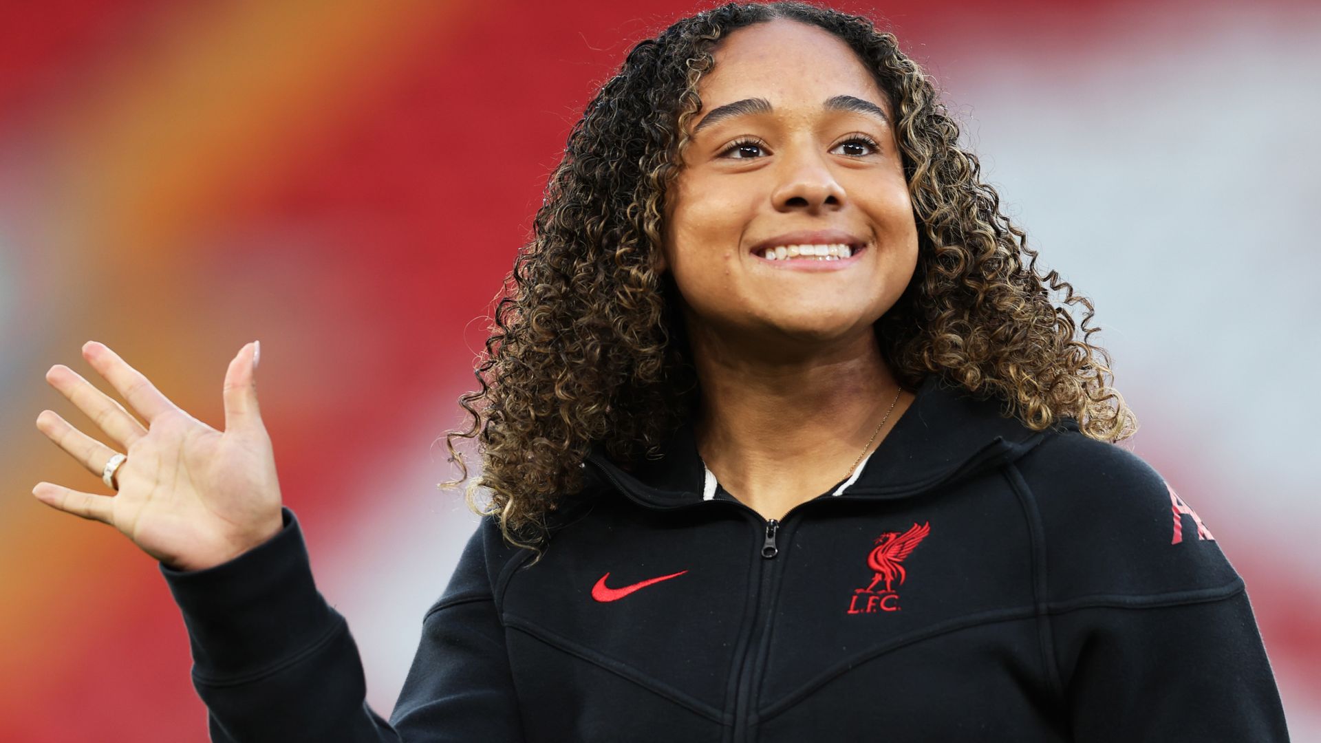 Arsenal sign Liverpool striker Smith for world-record fee