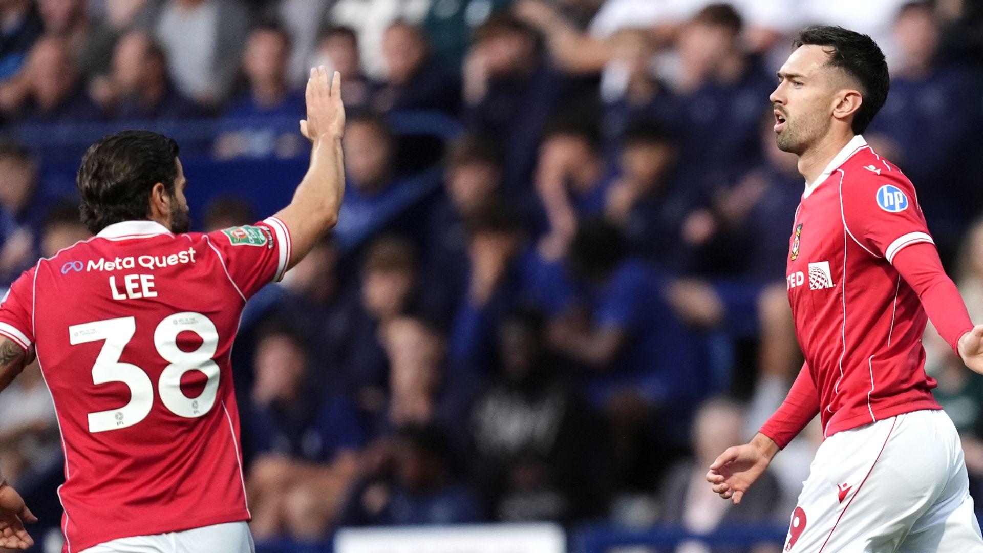 Wrexham win late at Preston to progress in Carabao Cup